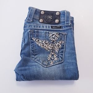 designer jeans with crosses on them